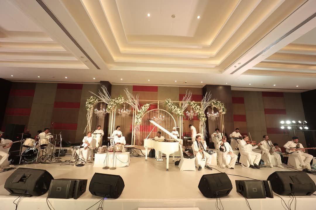 White theme instrumental band on a grand stage