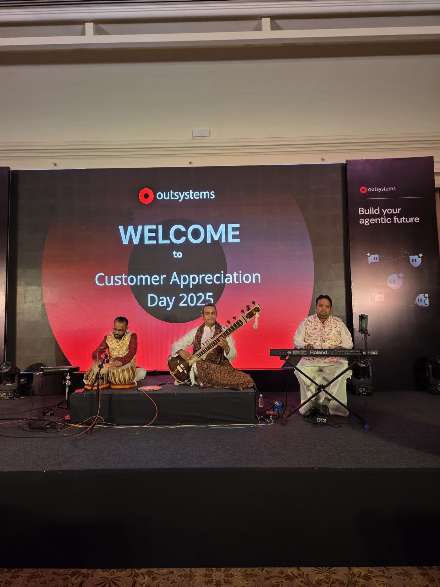 Sitar, tabla and keyboard instrumental trio on a corporate stage